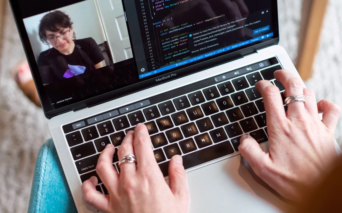 Developer working on a web application on a laptop