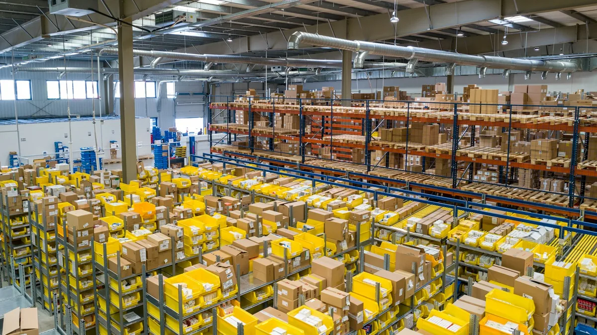 Large distribution warehouse with organised stock and fulfilment equipment